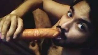 Horny Indian guy sucking a dildo and cumming hard
