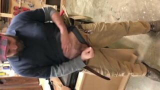 Horny working man strips in workshop with buddy