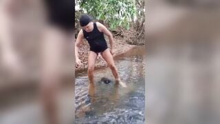 Man masturbation in outdoor river