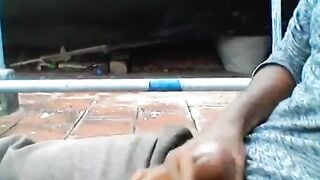 Indian black guy jerks his dick in terrace